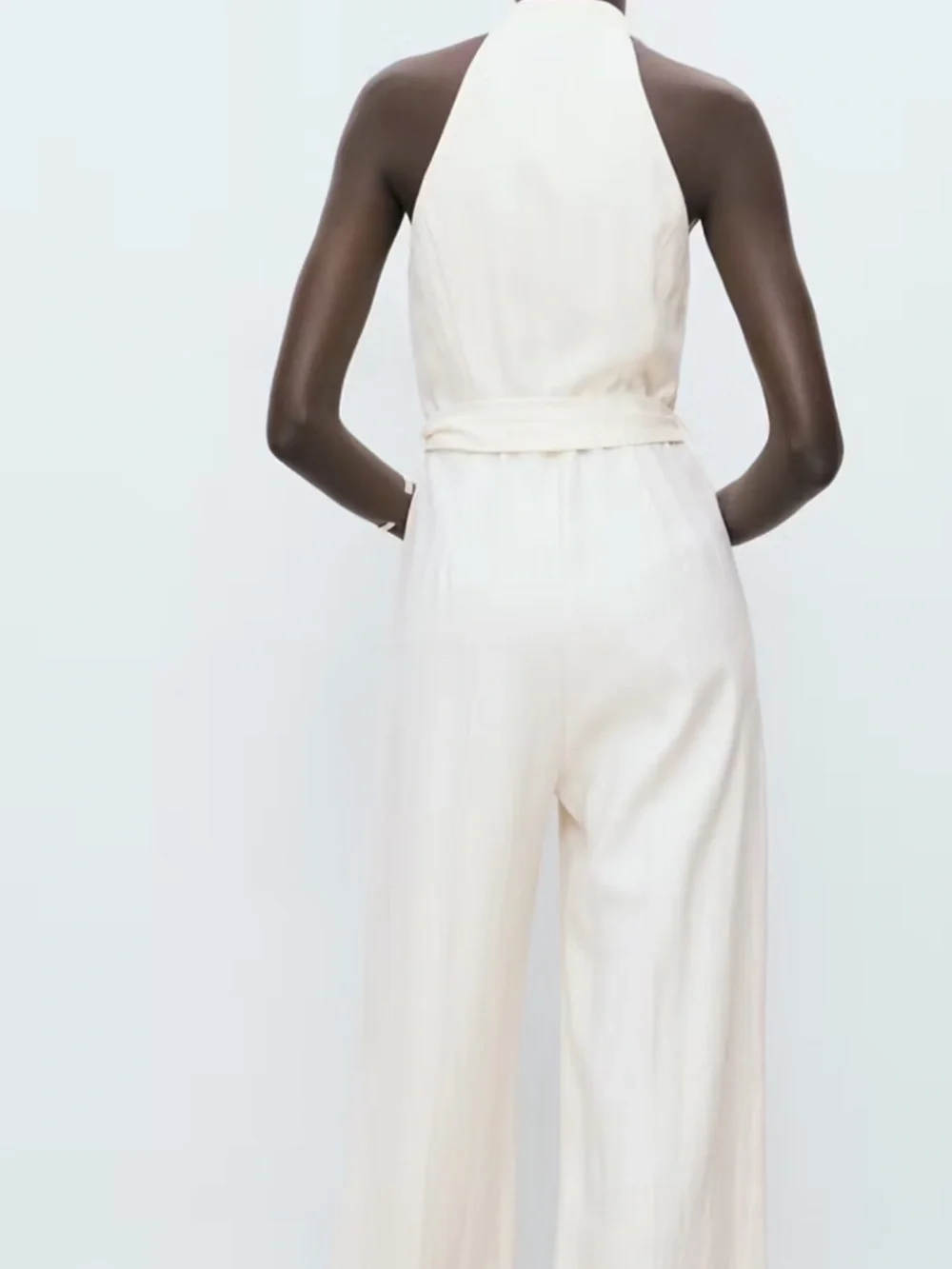 Halter-neck jumpsuit with belt